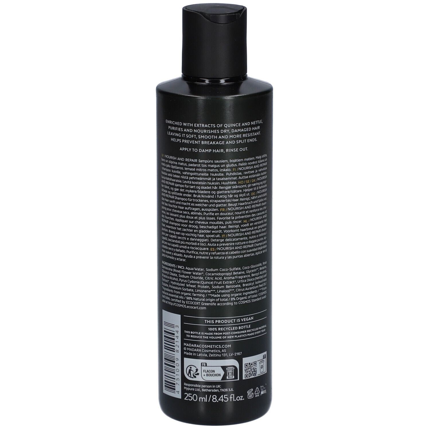 Achterkant van een donkergroene fles. Tekst met ingrediënten en gebruik. Zwarte dop. Veganistisch logo.