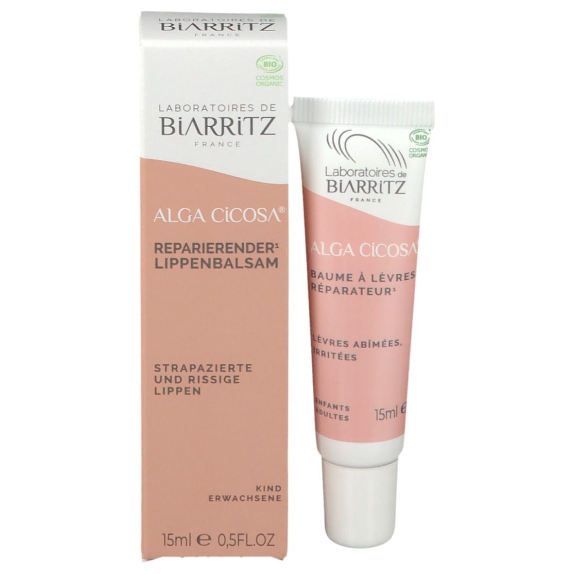 Emballage et tube de baume à lèvres. Emballage blanc/rose, tube rose/blanc. Nom du produit et 15ml.