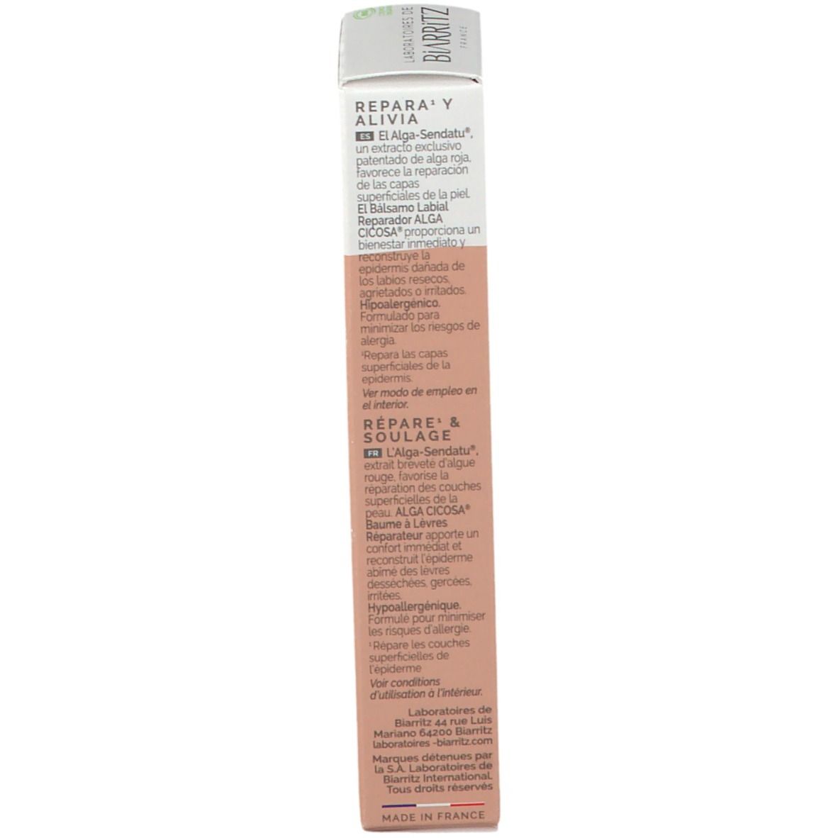 Dos de l'emballage du baume à lèvres. Texte avec informations. Blanc/rose. Fabriqué en France.