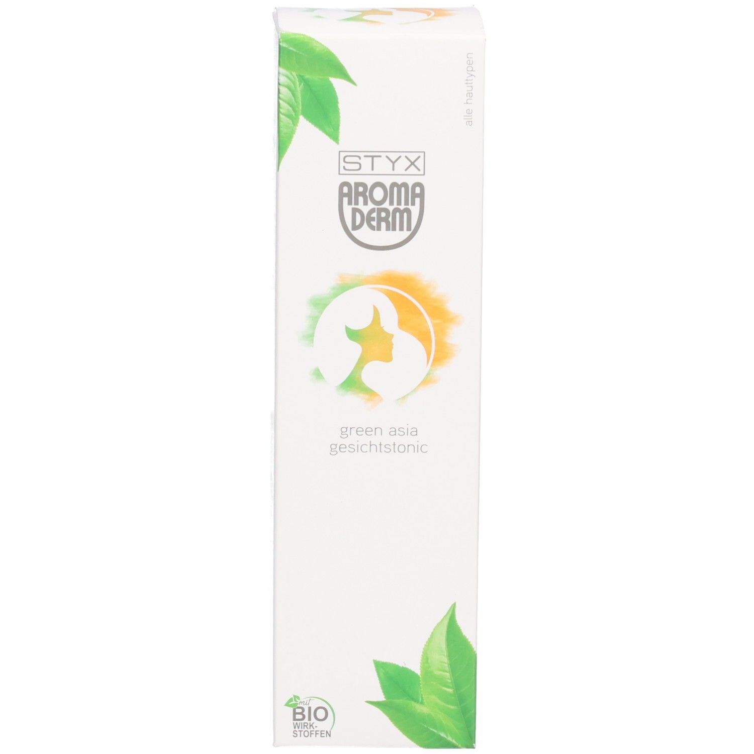 Emballage blanc du produit. Inscription: STYX AROMADERM, green asia Gesichtstonic. Décor de feuilles. Label bio.