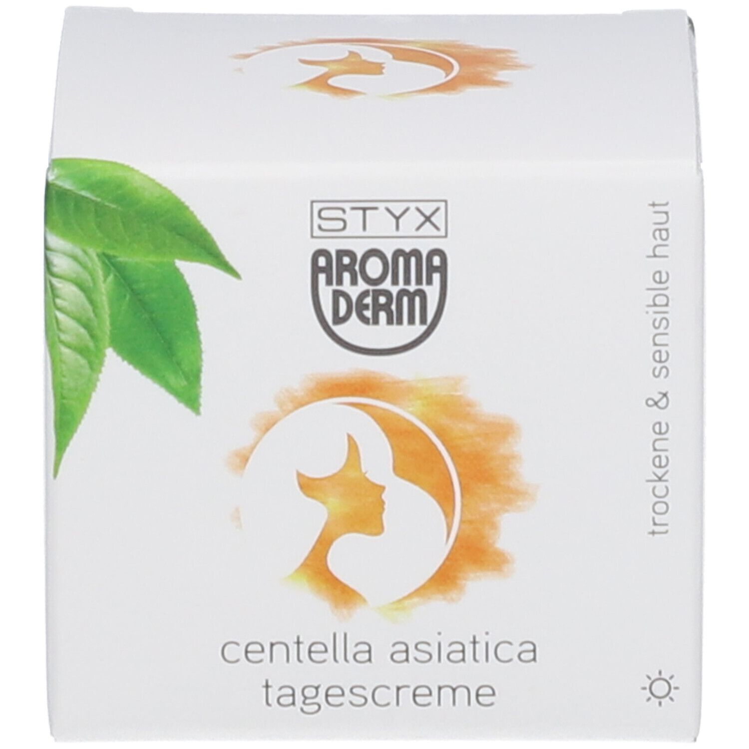 Carton avec logo, feuilles et texte: Centella Asiatica Tagescreme. Pour peaux sèches et sensibles. Symbole soleil.
