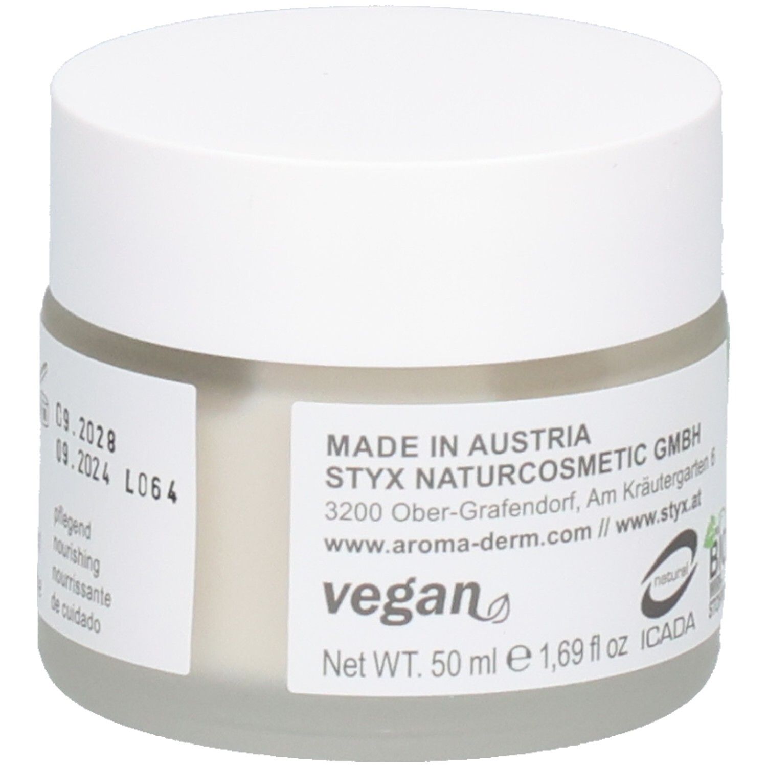 Pot de crème avec couvercle blanc. Autocollant avec texte: MADE IN AUSTRIA, STYX NATURCOSMETIC GMBH, vegan, certification BIO, ICADA.