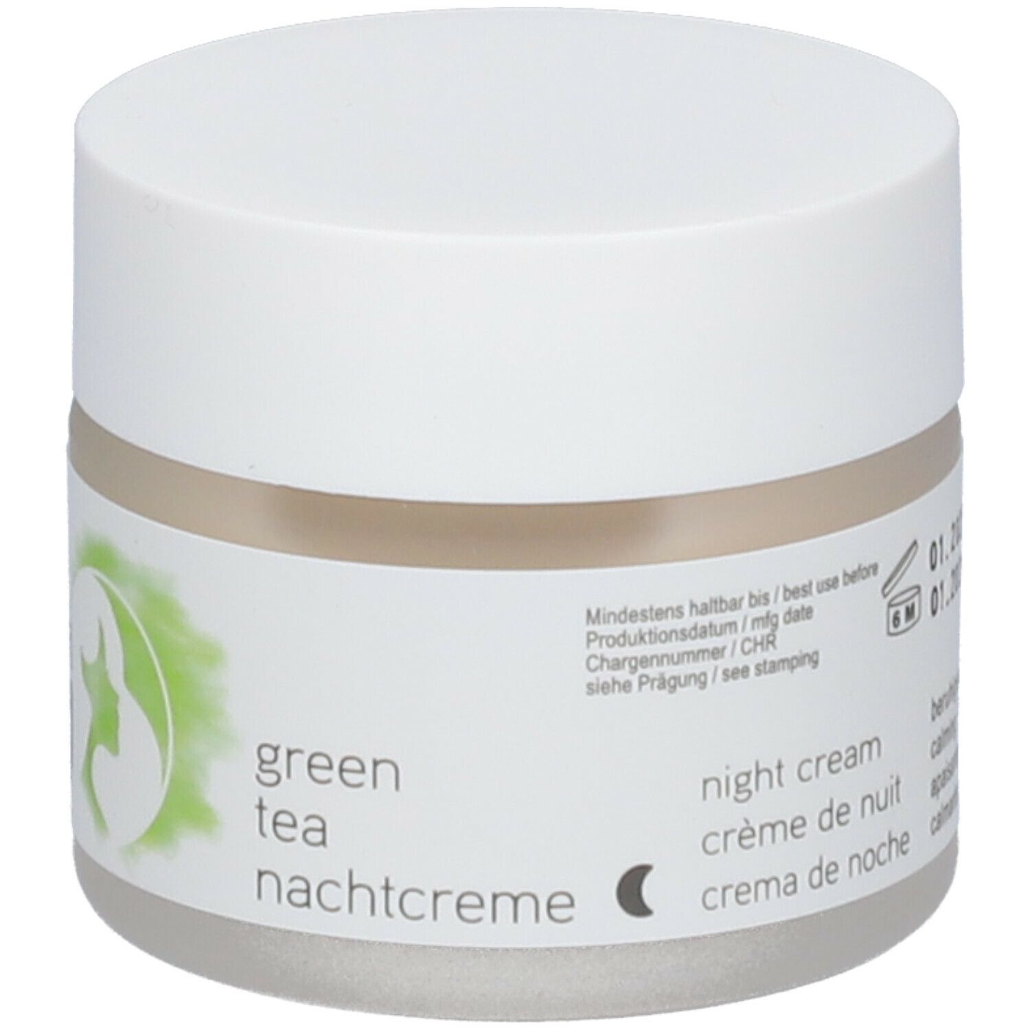 Pot de crème avec couvercle blanc. Étiquette : crème de nuit au thé vert, texte en allemand, français, italien, vegan.