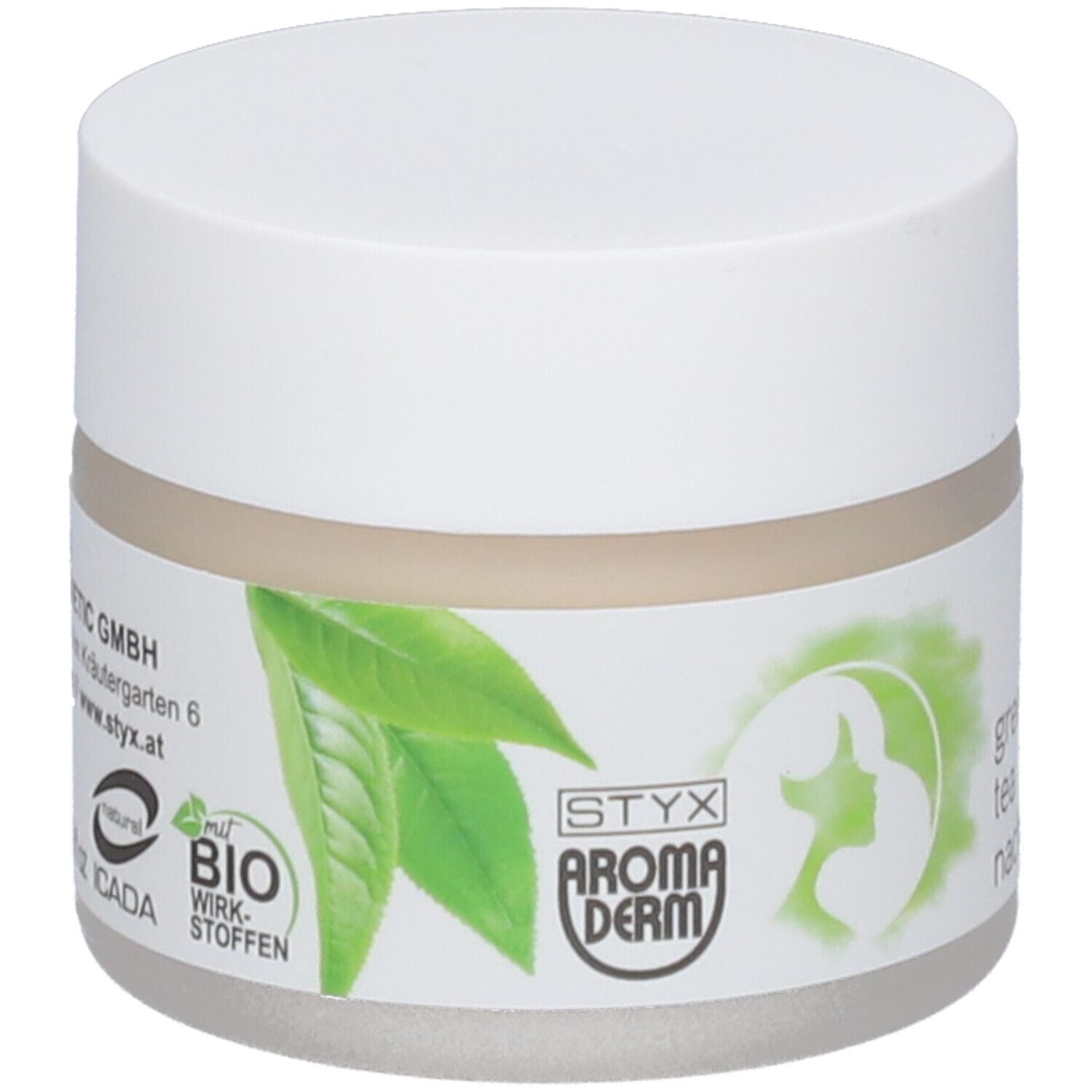Pot de crème avec couvercle blanc. Étiquette : STYX AROMADERM, feuilles vertes, crème de nuit au thé vert, label bio, vegan.