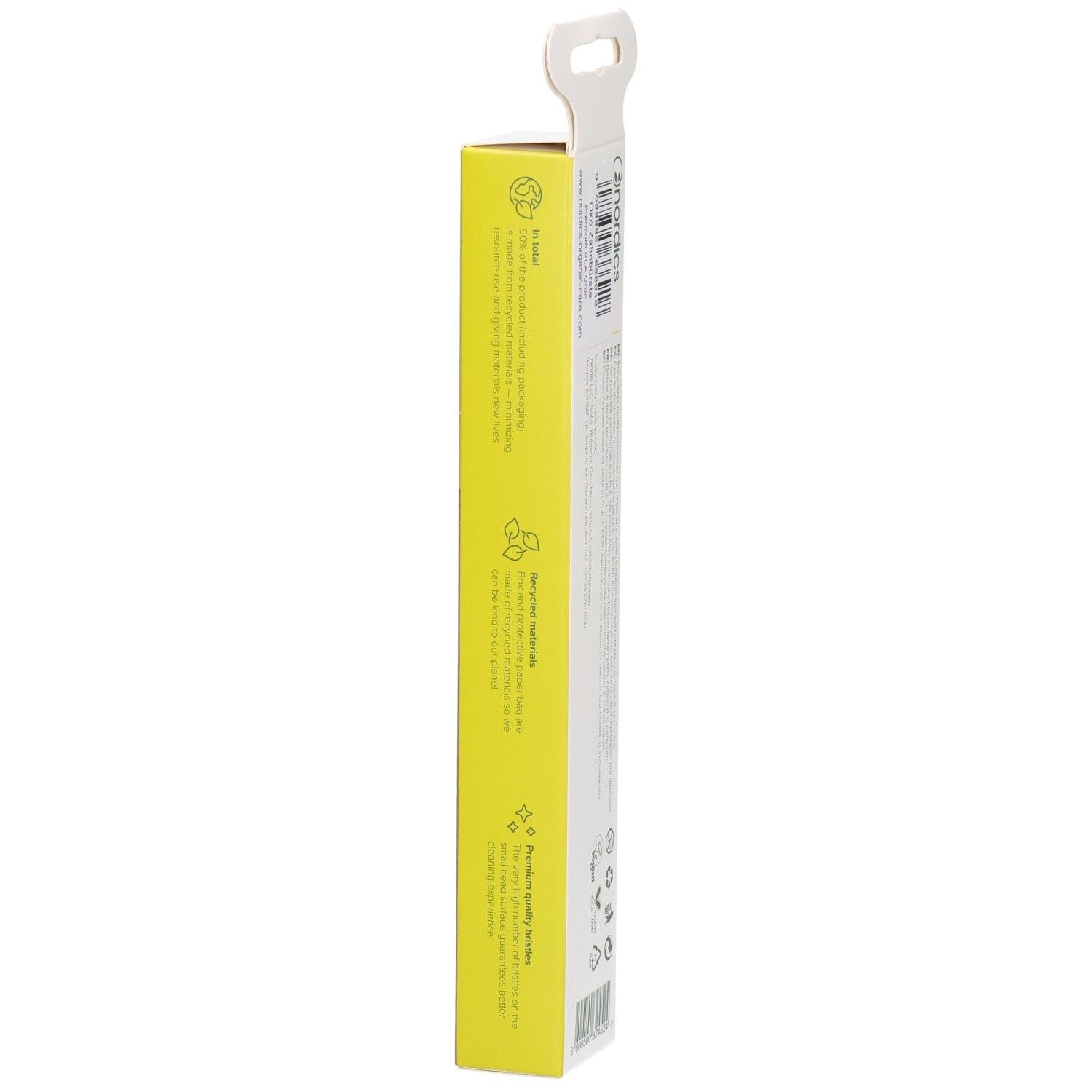 Vue latérale de l'emballage avec texte. Texte : Brosse à dents durable. Marque : nordics. Symboles de durabilité.