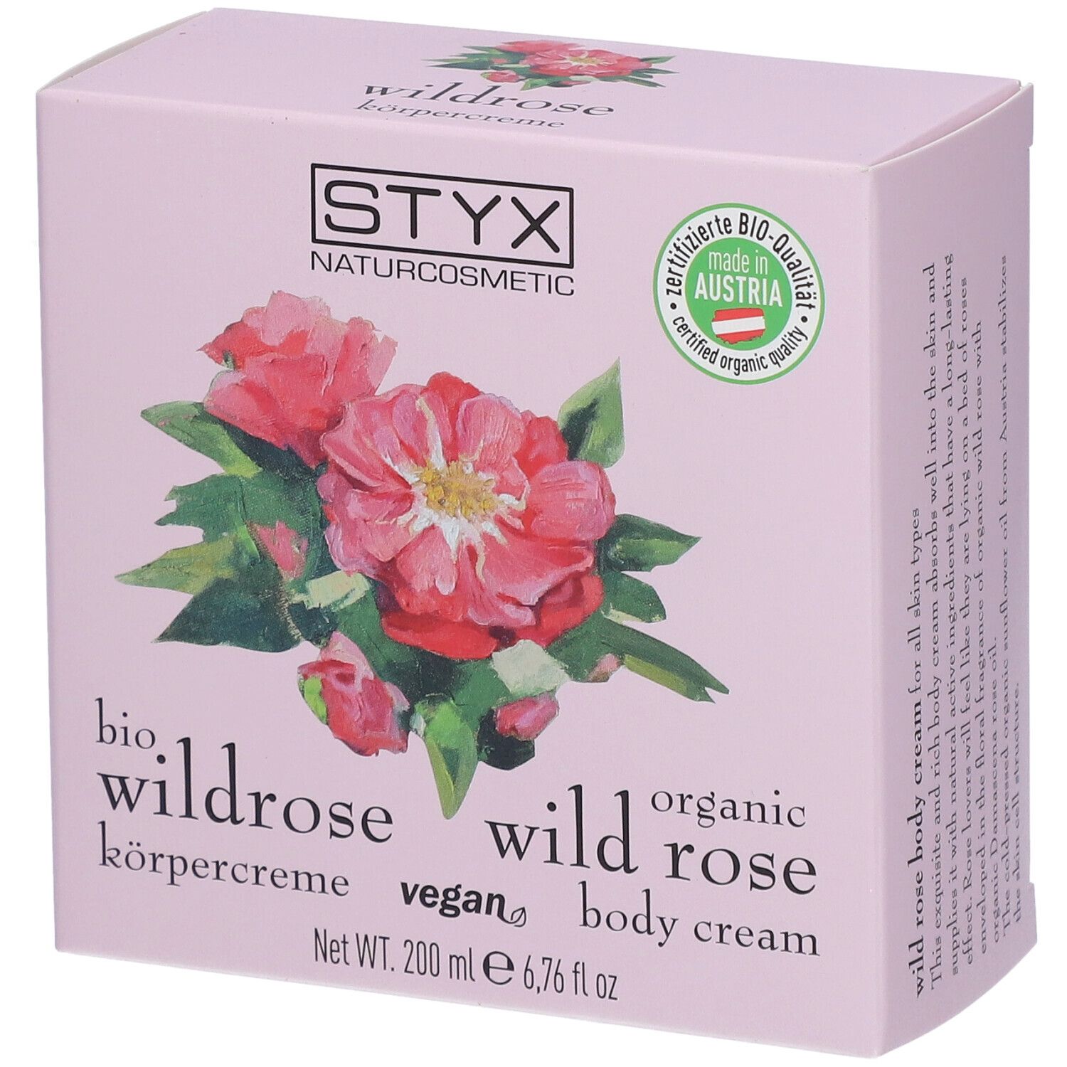 Roze bodycrème verpakking met STYX logo, wilde roos illustratie en bio-kwaliteit zegel.