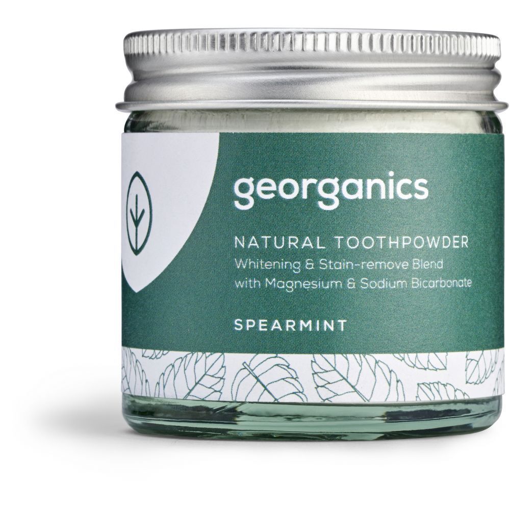 Tandpoeder in glazen pot met schroefdop. Opschrift: georganics, Natural Toothpowder Spearmint.