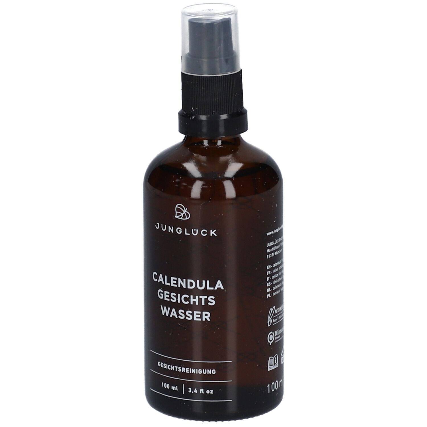 Flacon en verre brun avec vaporisateur. Inscription: JUNGLÜCK, CALENDULA GESICHTS WASSER. Nettoyant visage.