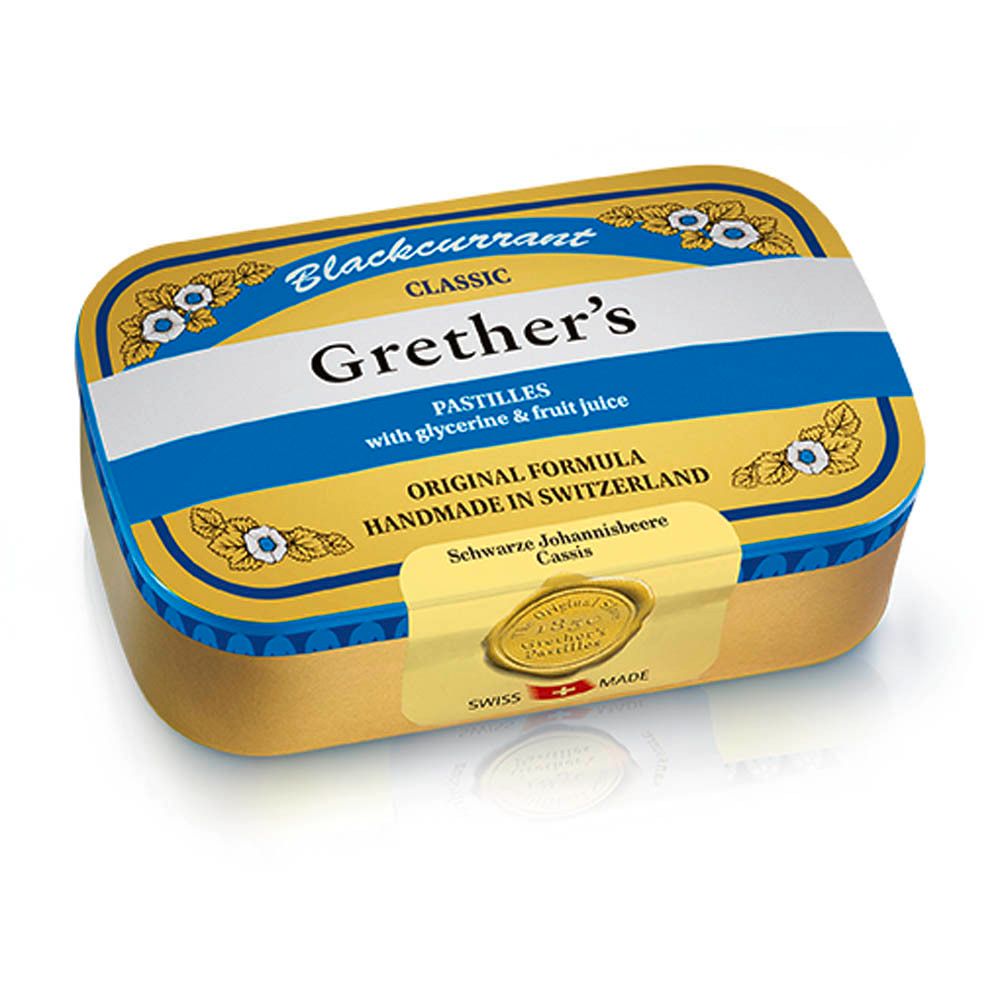 Goudkleurige doos met blauw-witte tekst. Bevat pastilles. Opschrift: Grether's Pastilles, Swiss Made.