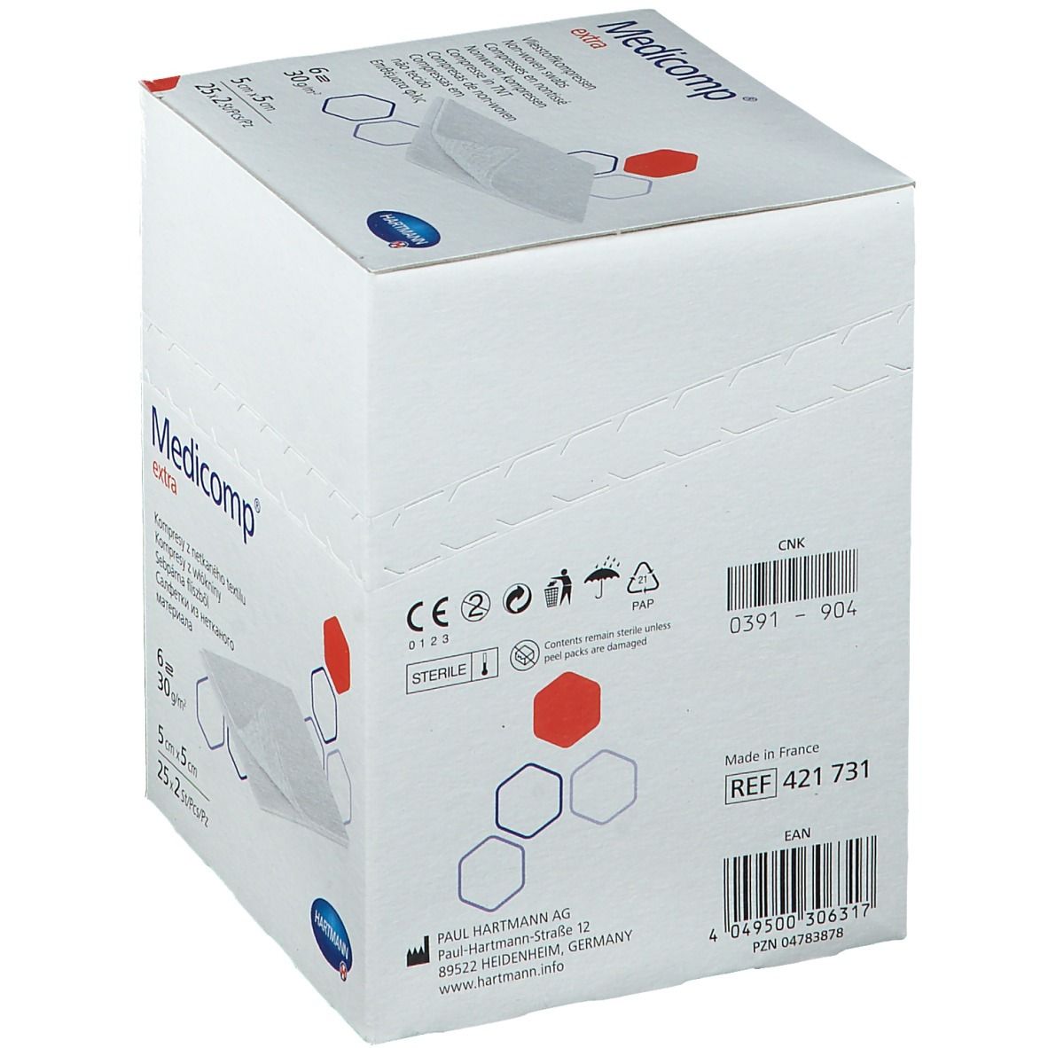 Witte verpakking met "Medicomp extra" logo. Bevat steriele kompressen. Fabrikant: Hartmann. Met barcode en referentie.