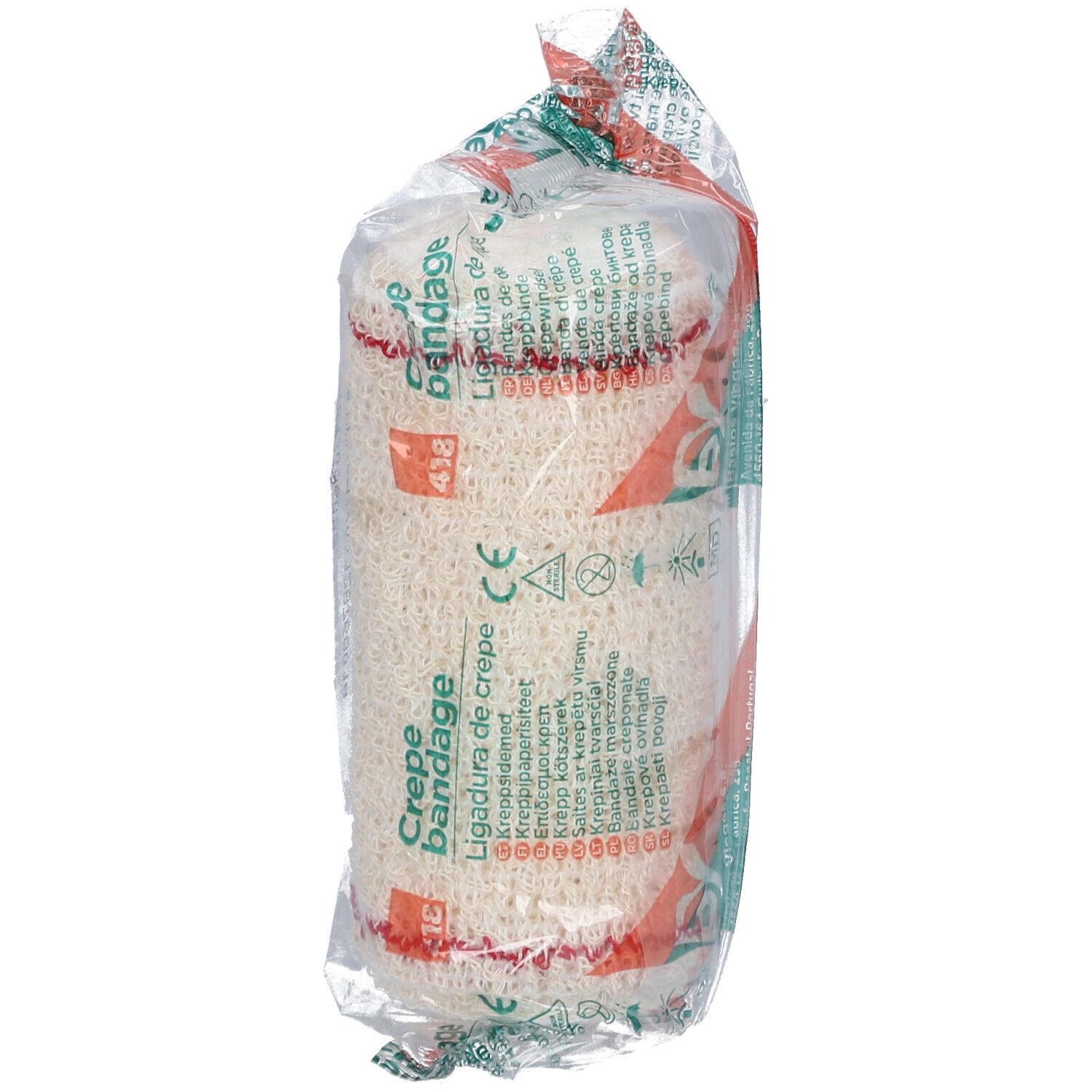 Rouleau de bandage dans un emballage transparent. Impression : Crêpe Bandage, Ligadura de crepe. Filet rouge. Marque CE.