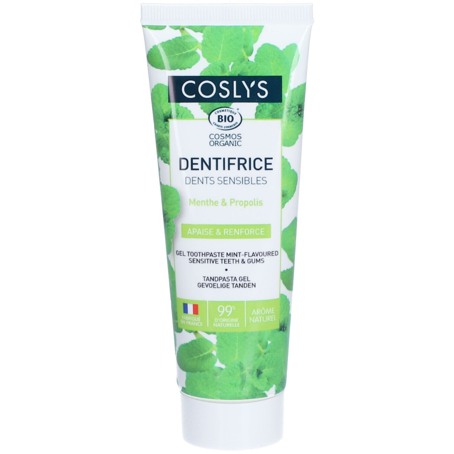 Tube de dentifrice Coslys. Inscription : Dentifrice Dents Sensibles Menthe & Propolis. Certifié bio. Fond vert avec feuilles.