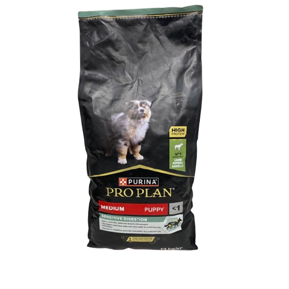 Sac noir de nourriture pour chiens. Inscription : PURINA PRO PLAN, Medium, Puppy, Sensitive Digestion. Image d'un chiot.