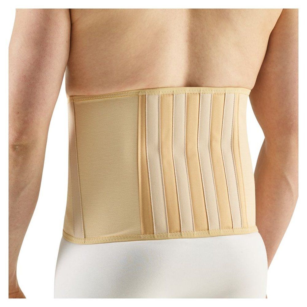 Support dorsal beige, renforts verticaux. Porté sur le dos d'une personne.