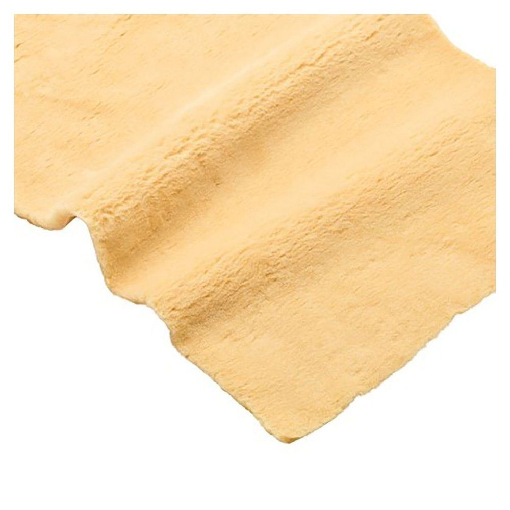 Beige materiaal, plat uitgespreid. Het oppervlak is gestructureerd. Geen verdere details zichtbaar.