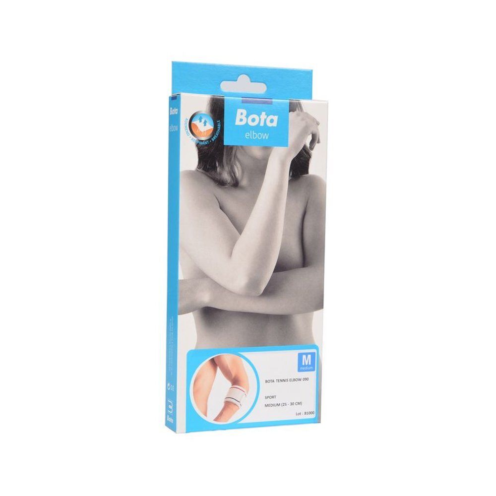 Jambes d'une femme portant des bas de compression couleur chair, assise sur une surface blanche.