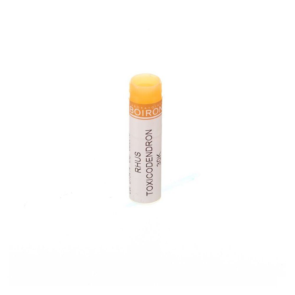 Tube cylindrique avec bouchon jaune. Inscription: BOIRON, Rhus Toxicodendron 30K.