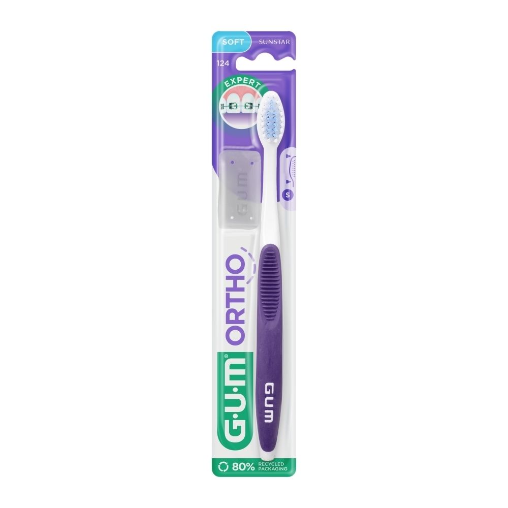 Brosse à dents avec manche violet et tête blanche. Emballage blister avec logo GUM Ortho.