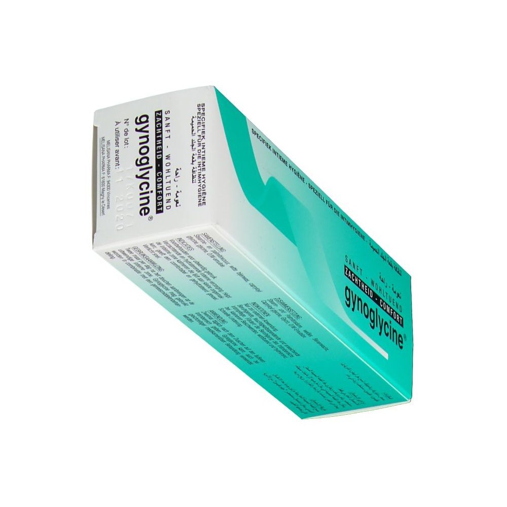 Verpakking van gynoglycine® in perspectief. Turquoise en wit design. Tekst: Zacht, weldadig, comfort. Meertalige tekst.