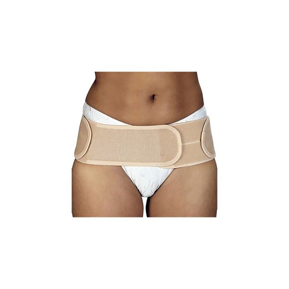 Beige Bota Lumbota Sacro-Iliacale Skin Large. Klittenbandsluiting. Gedragen op wit ondergoed. Vooraanzicht.