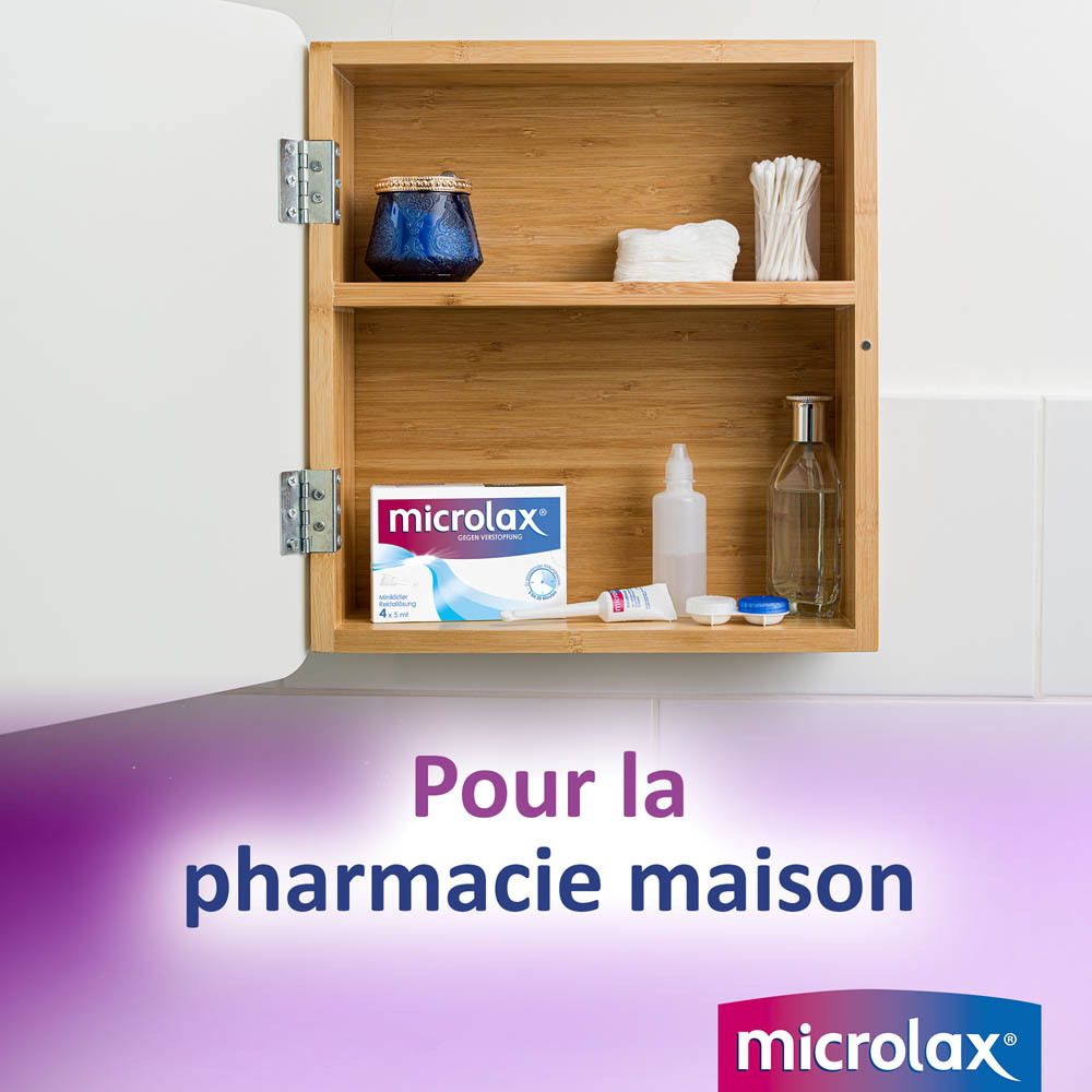 Armoire de salle de bain avec produits. Emballage Microlax visible. Texte : Pour la pharmacie maison. Logo Microlax.