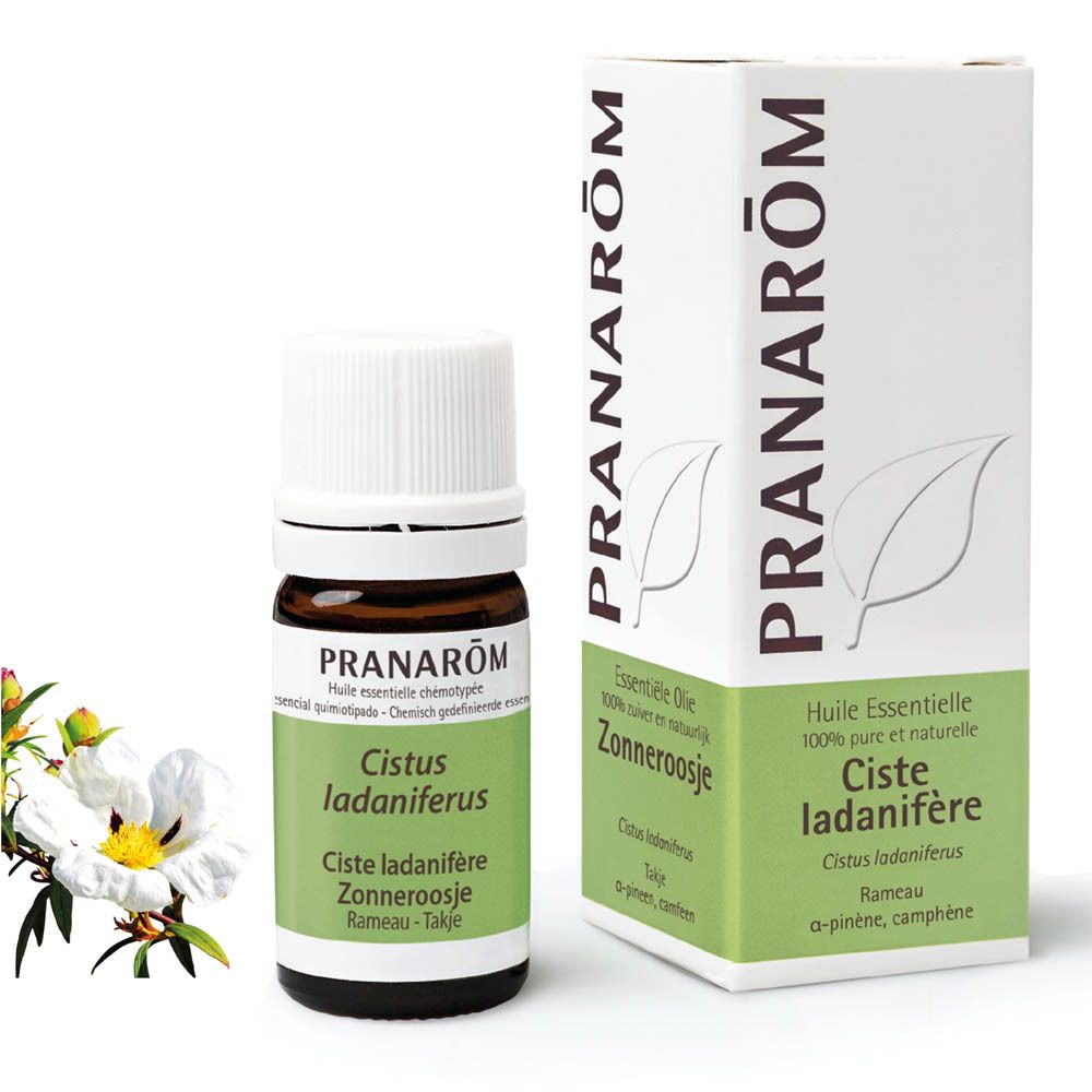 Bruine glazen fles en doos. Doos en fles met productnaam en merk: PRANAROM. Witte dop.