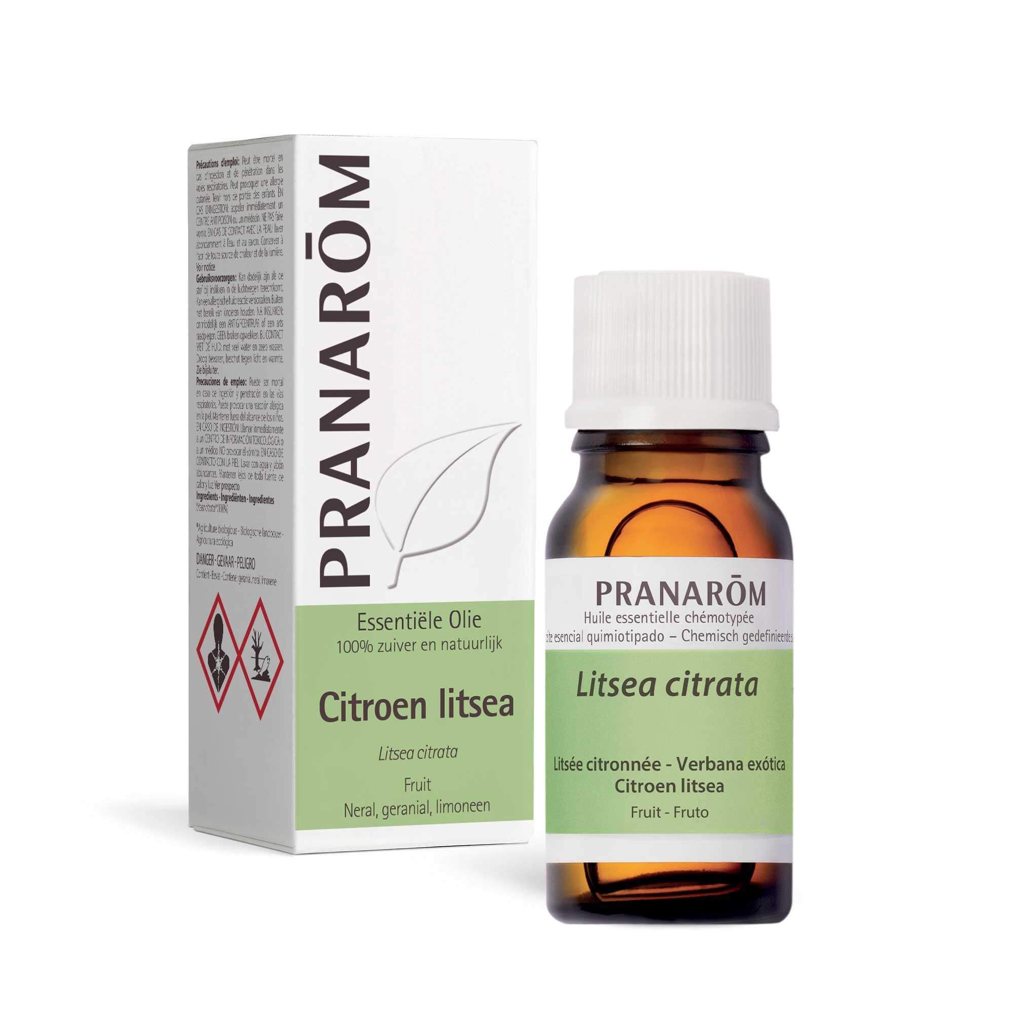 Bruine glazen fles en doos. Opschrift: PRANAROM, Citroen litsea. Gevarensymbolen.