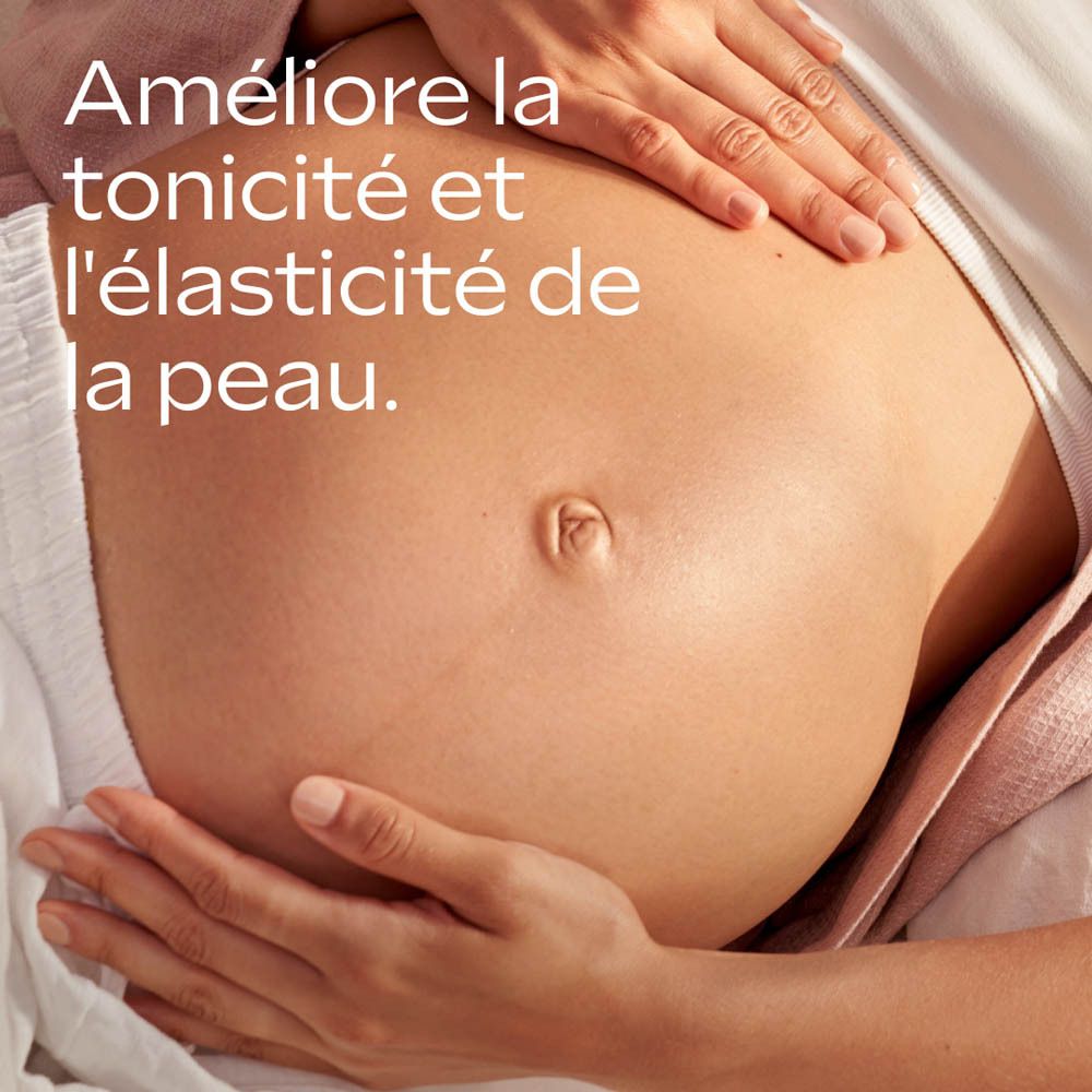 Huile de soin grossesse Weleda: application sur ventre de femme enceinte. Prévient et réduit les vergetures.