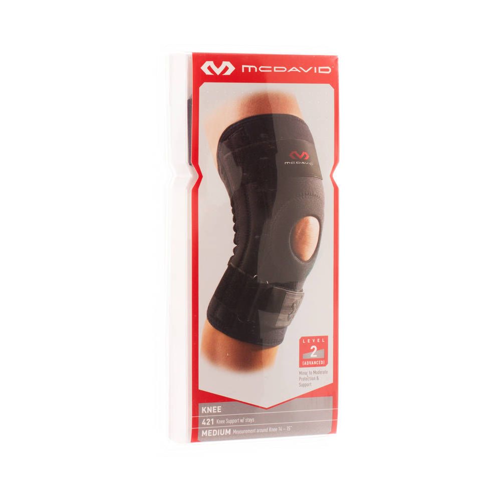 Zwarte McDavid kniebrace, model 421, maat M, in verpakking. Zichtbare kenmerken: patella-ondersteuning, 2 jaar garantie.
