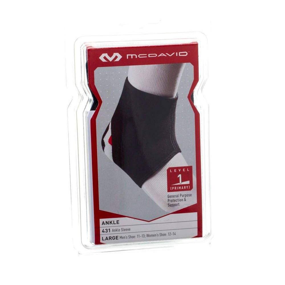 Zwarte McDavid enkelbrace in verpakking. Maat L. Level 1 bescherming. Zichtbare maatindicaties.