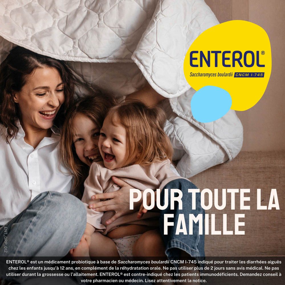 Publicité ENTEROL. Famille riant sous une couverture.