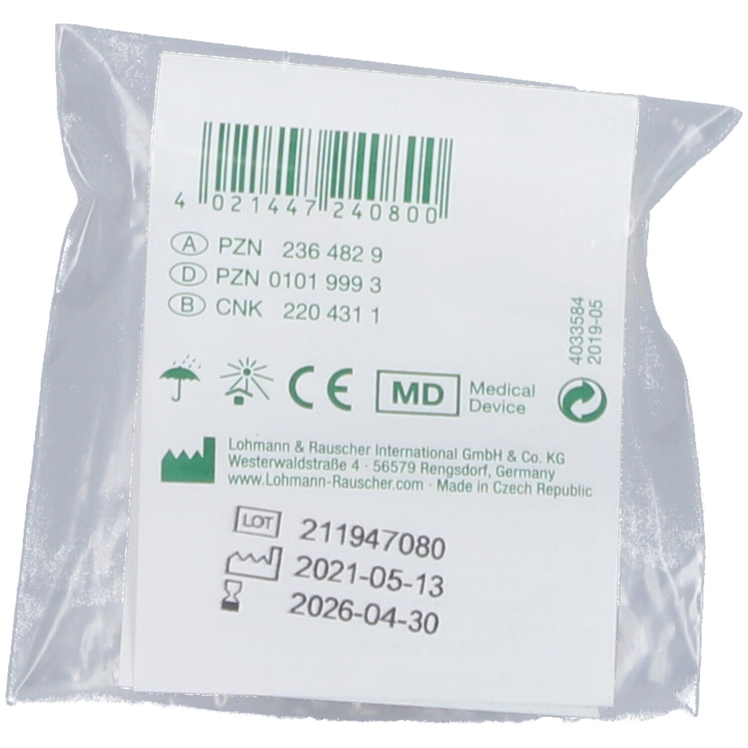 Achterkant van de plastic verpakking met barcode, CE-markering, fabrikantgegevens en lotnummer.