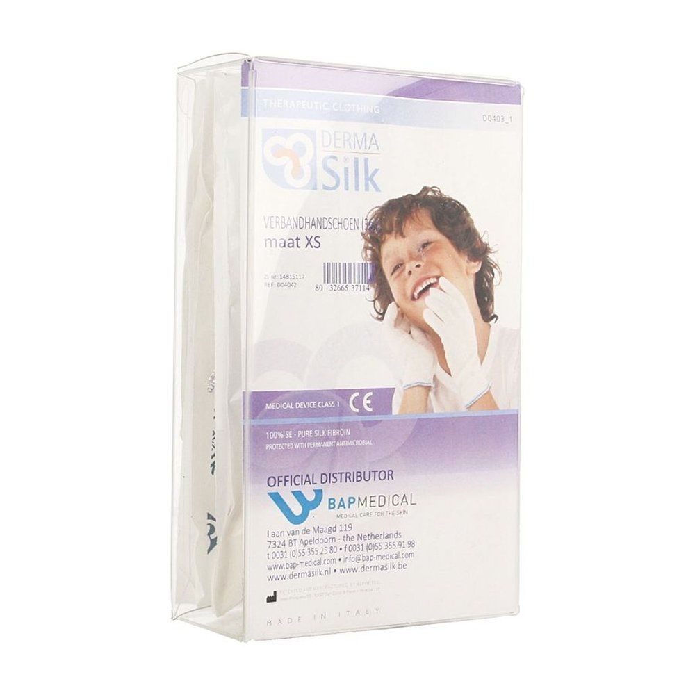 Verbandhandschoenen XS in verpakking. Merk Dermasilk. Opschrift: CE-markering, BAPMEDICAL. Kind met handschoenen.