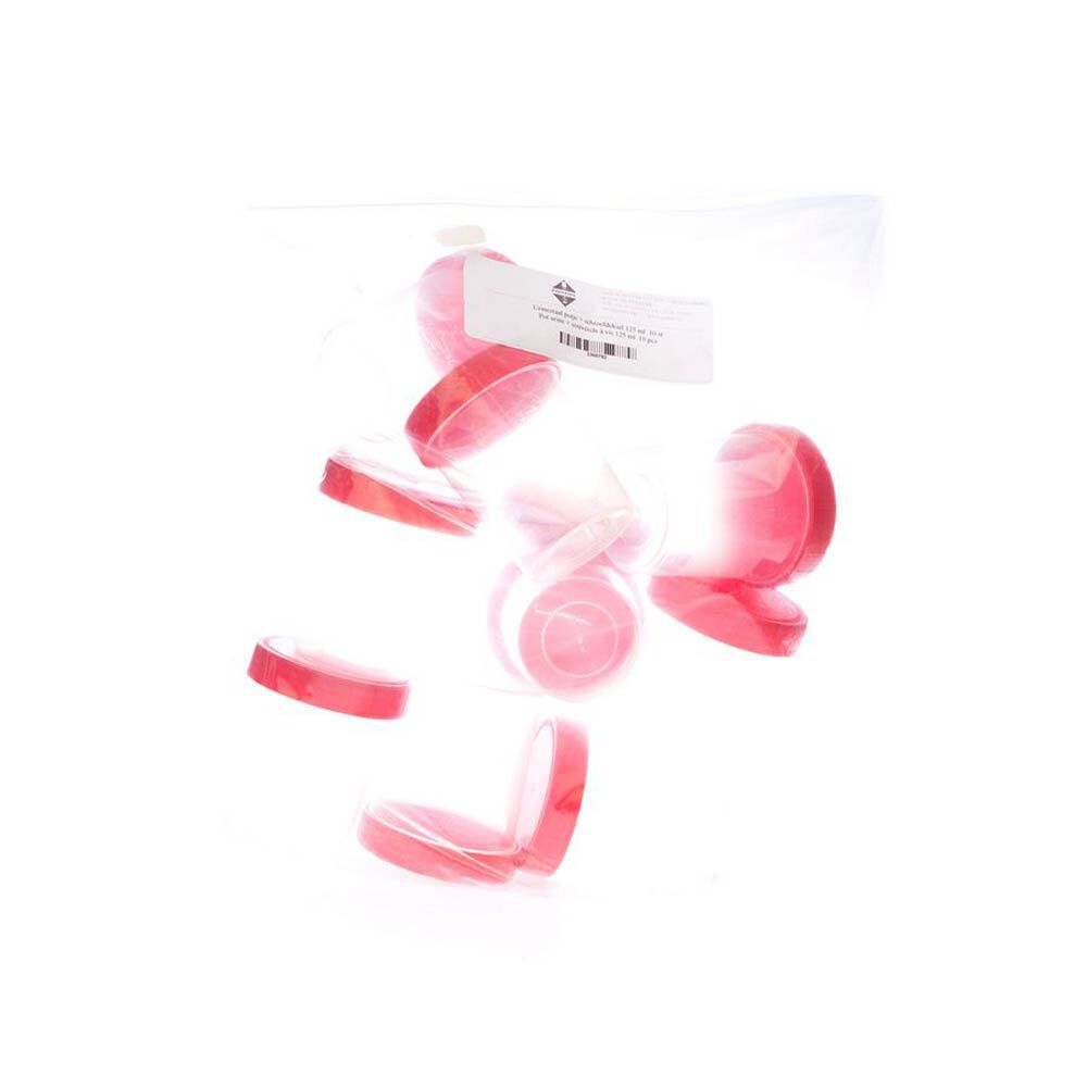 Couvercles à vis rouges et une étiquette dans un sac plastique transparent. Les couvercles sont disposés en vrac.