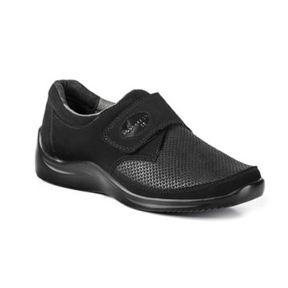 Chaussure noire avec fermeture velcro. Dessus perforé, semelle arrondie. Logo Podartis sur la bride.