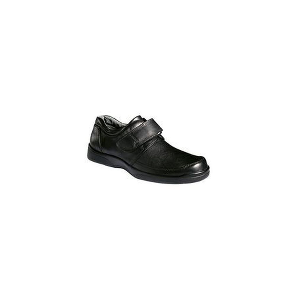 Chaussure homme noire avec fermeture velcro. Caractéristiques visibles : cuir, semelle plate. Vue latérale.