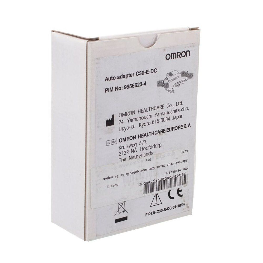 Emballage blanc imprimé. Texte: "Auto adapter C30-E-DC". La marque OMRON est également visible.
