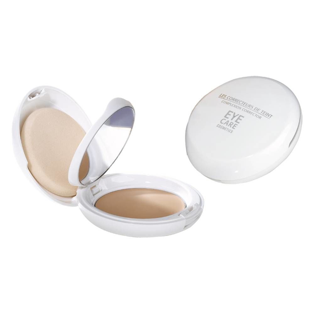 Witte, ovale compactpoeder met spiegel en applicator. Op het deksel staat "Eye Care".