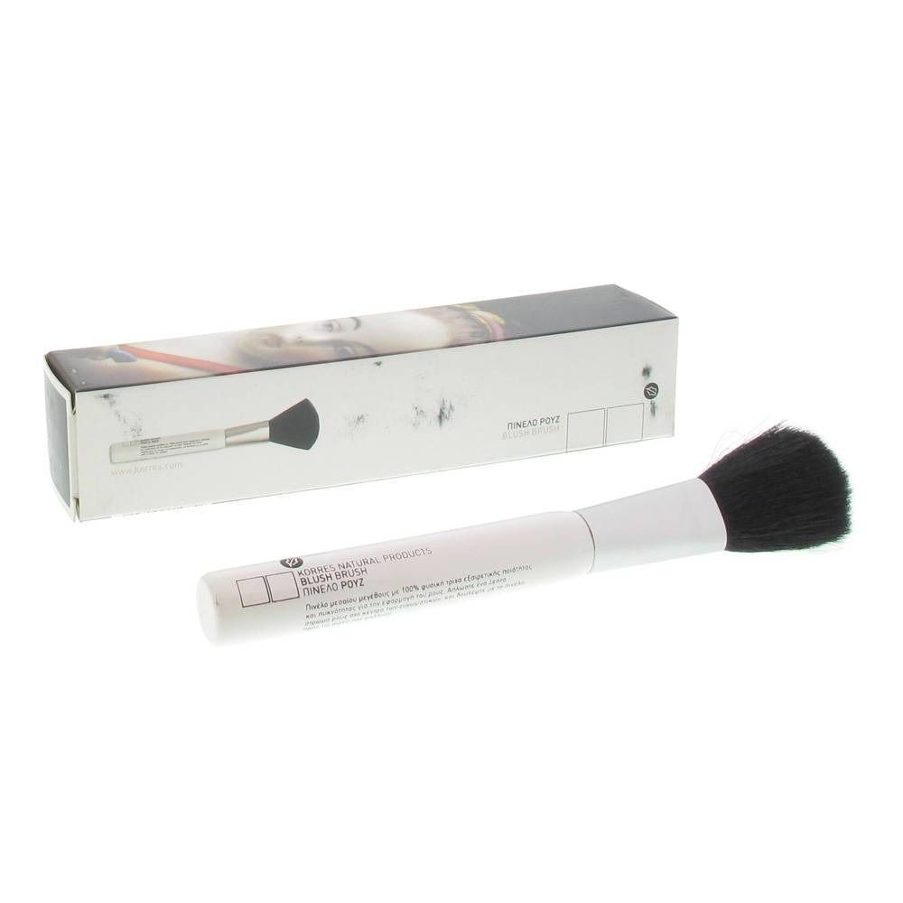 Pinceau de maquillage avec manche blanc et touffe noire, à côté de son emballage rectangulaire.