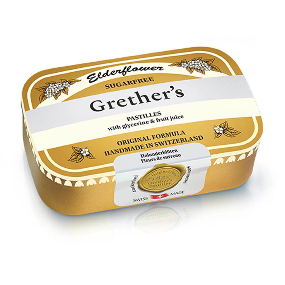 Gouden doosje Grether's Pastilles. Opschrift: Elderflower, suikervrij. Met witte band en zegel.
