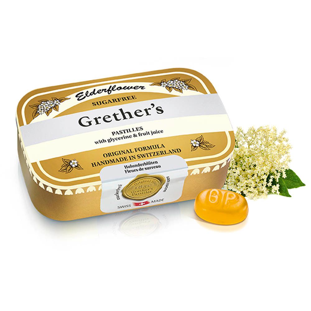 Gouden doosje Grether's Pastilles met een pastille en vlierbloesem. Opschrift: Elderflower, suikervrij.