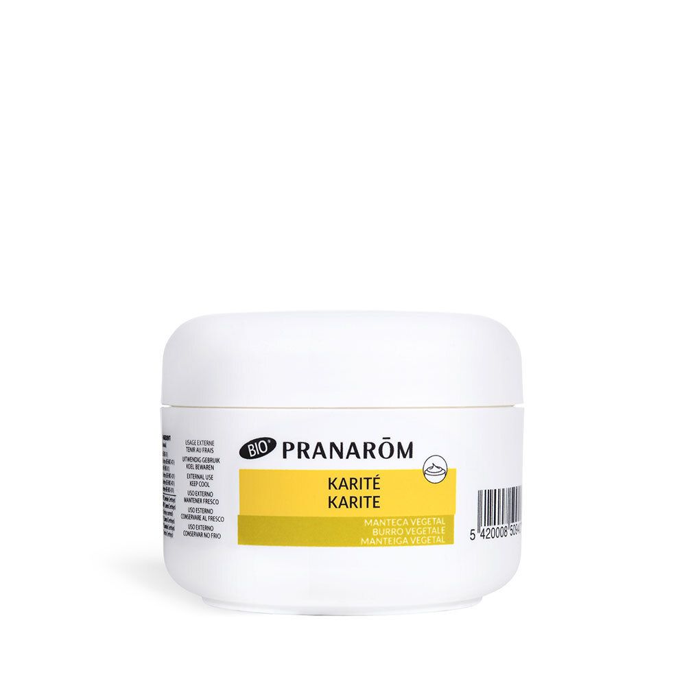 Pot blanc avec couvercle. Inscription: PRANAROM, KARITÉ, BIO. Beurre végétal.