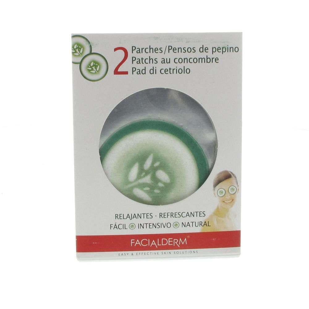 Verpakking met twee oogpads in de vorm van komkommerschijfjes. Opschrift: FACIALDERM. Tekst in het Spaans, Frans en Italiaans.