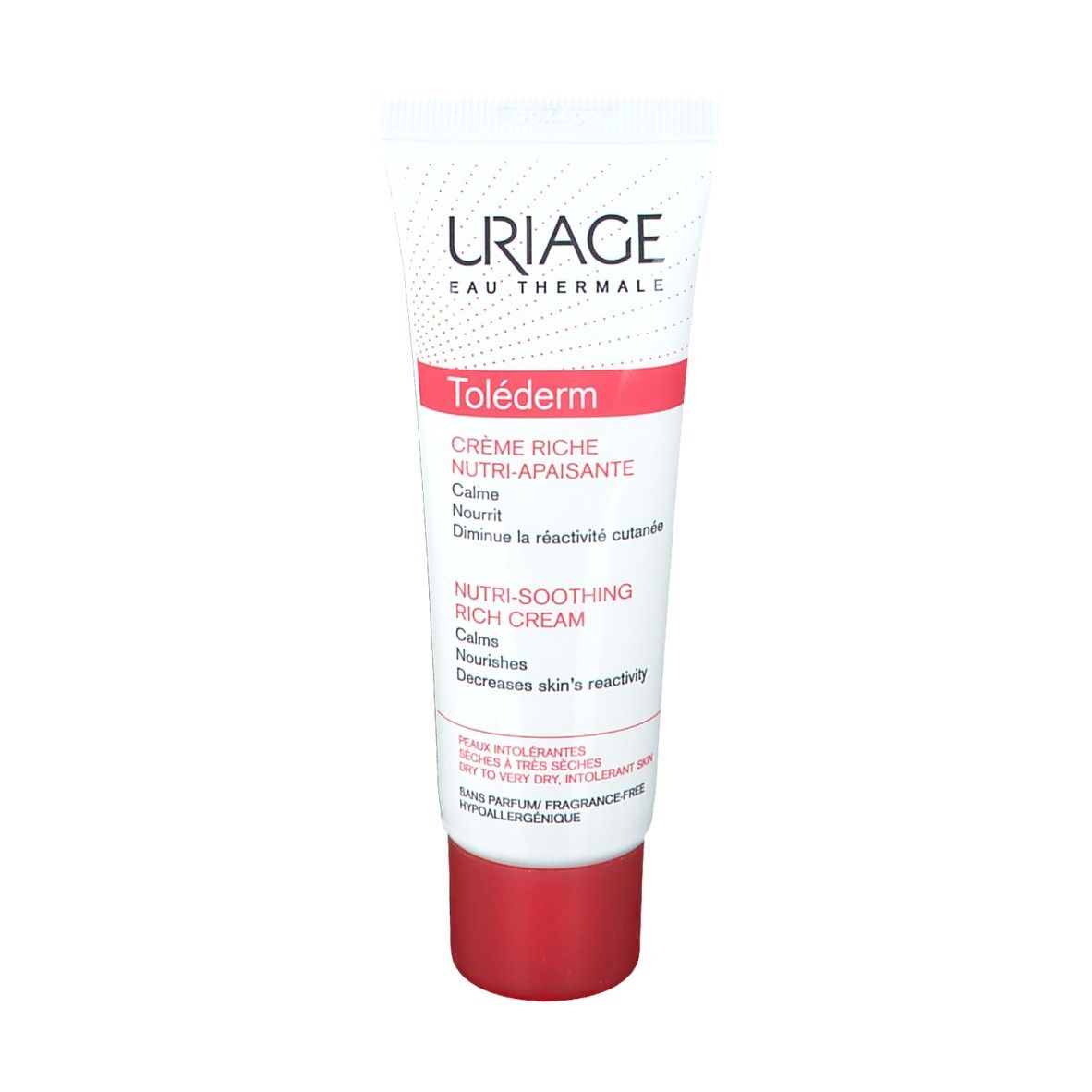 Witte tube met rode dop. Opschrift: URIAGE, Toléderm, Crème Riche. Tekst in het Frans en Engels.