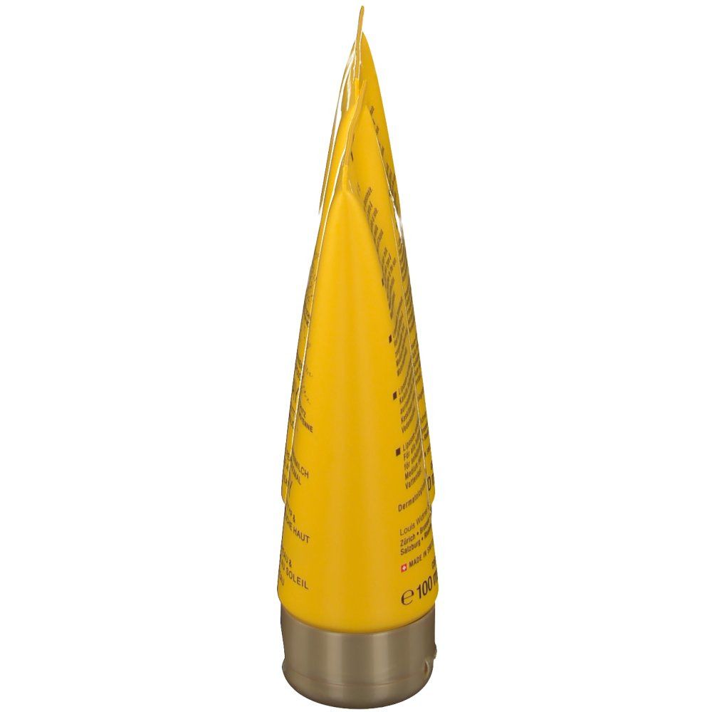 Gele tube, goudkleurige dop. Tekst op de tube. Opdruk: e 100 ml.