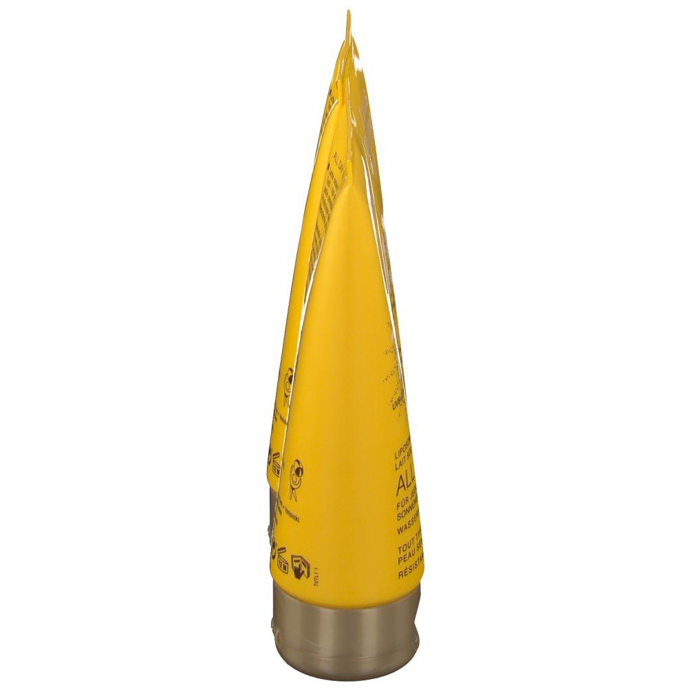 Gele tube, goudkleurige dop. Tekst op de tube.