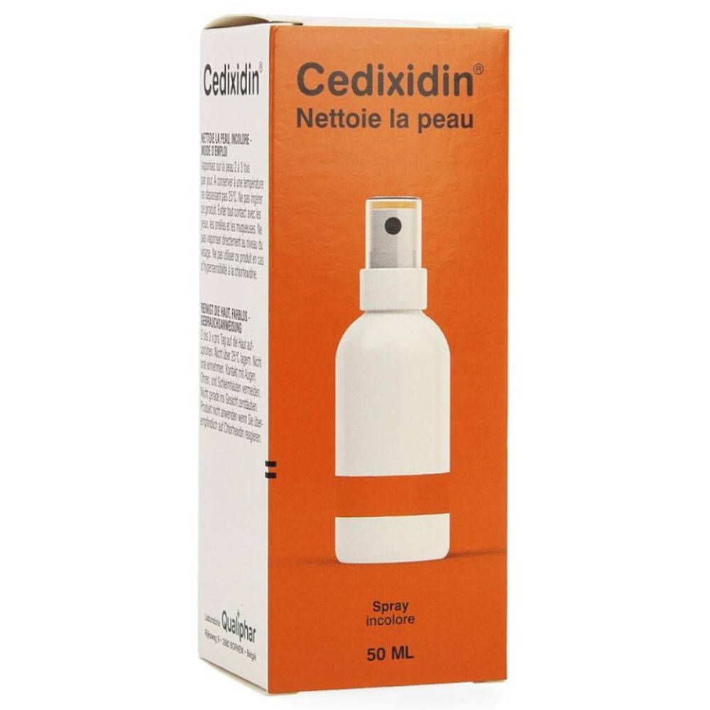Doos Cedixidin. Oranje achtergrond. Witte sprayfles. Tekst: Nettoie la peau, Spray incolore, 50 ml.