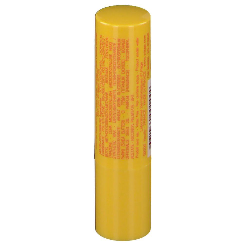 Stick à lèvres jaune avec texte. Contient ingrédients et informations fabricant.