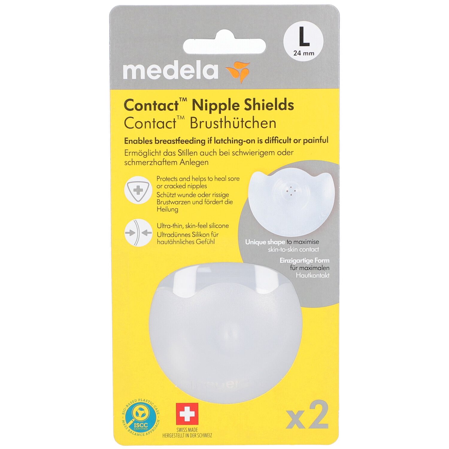 Verpakking met twee tepelbeschermers. Merk: Medela. Maat L, 24 mm. Transparante siliconen tepelbeschermers in gele verpakking.