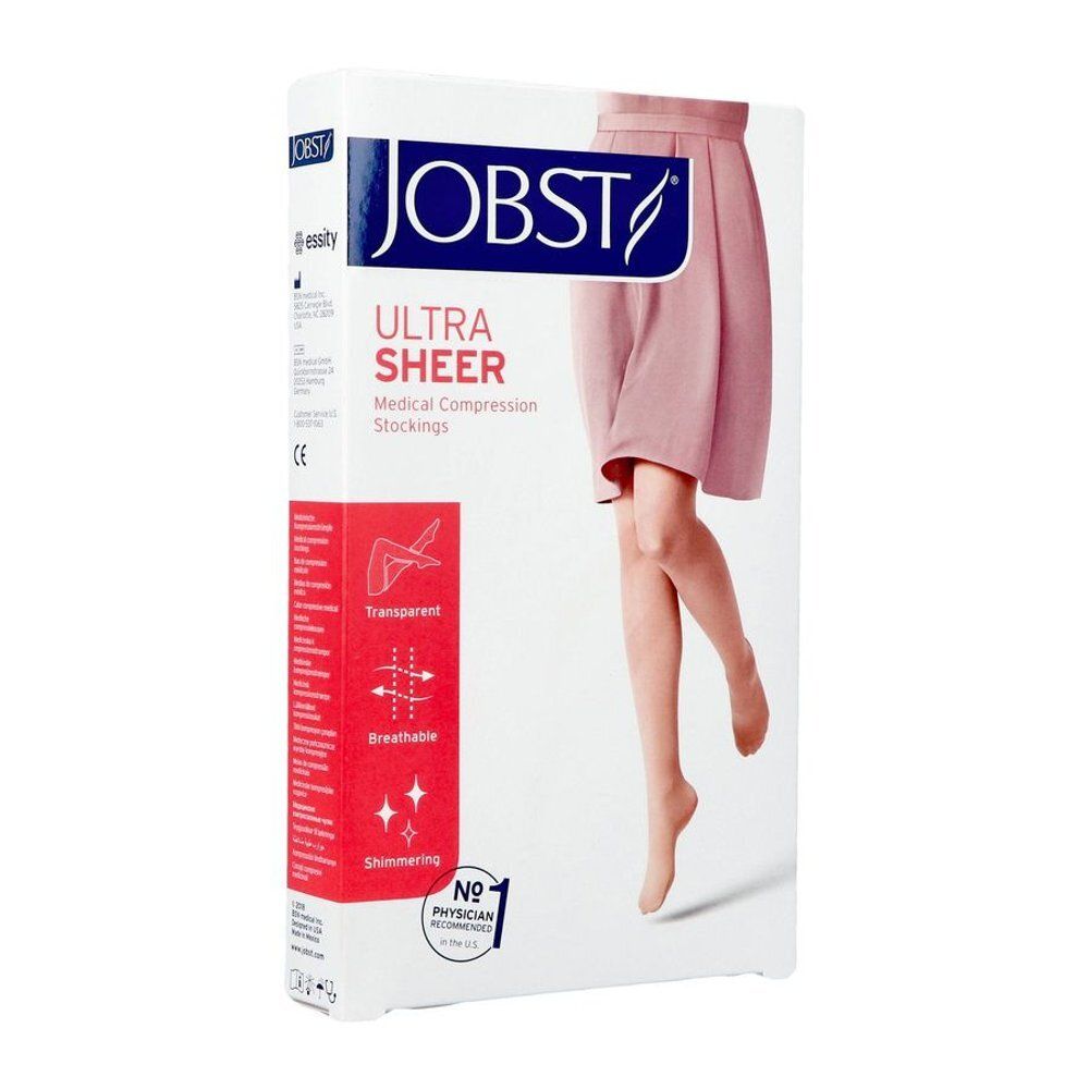 Emballage de bas de compression JOBST. Bas transparents représentés. Texte: Ultra Sheer Medical Compression Stockings. Caractéristiques: transparent, respirant, brillant.